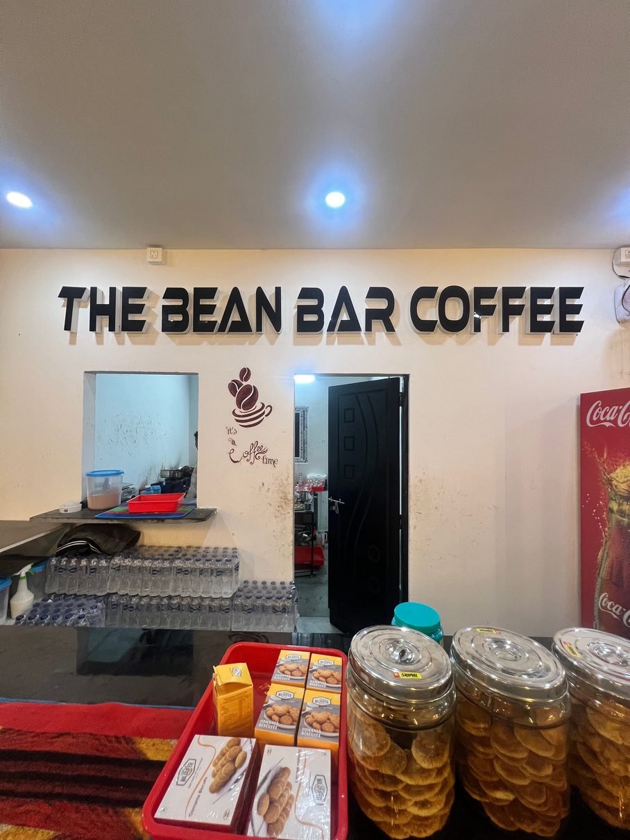 Inside a Bean Bar Coffee shop counter with snacks and supplies